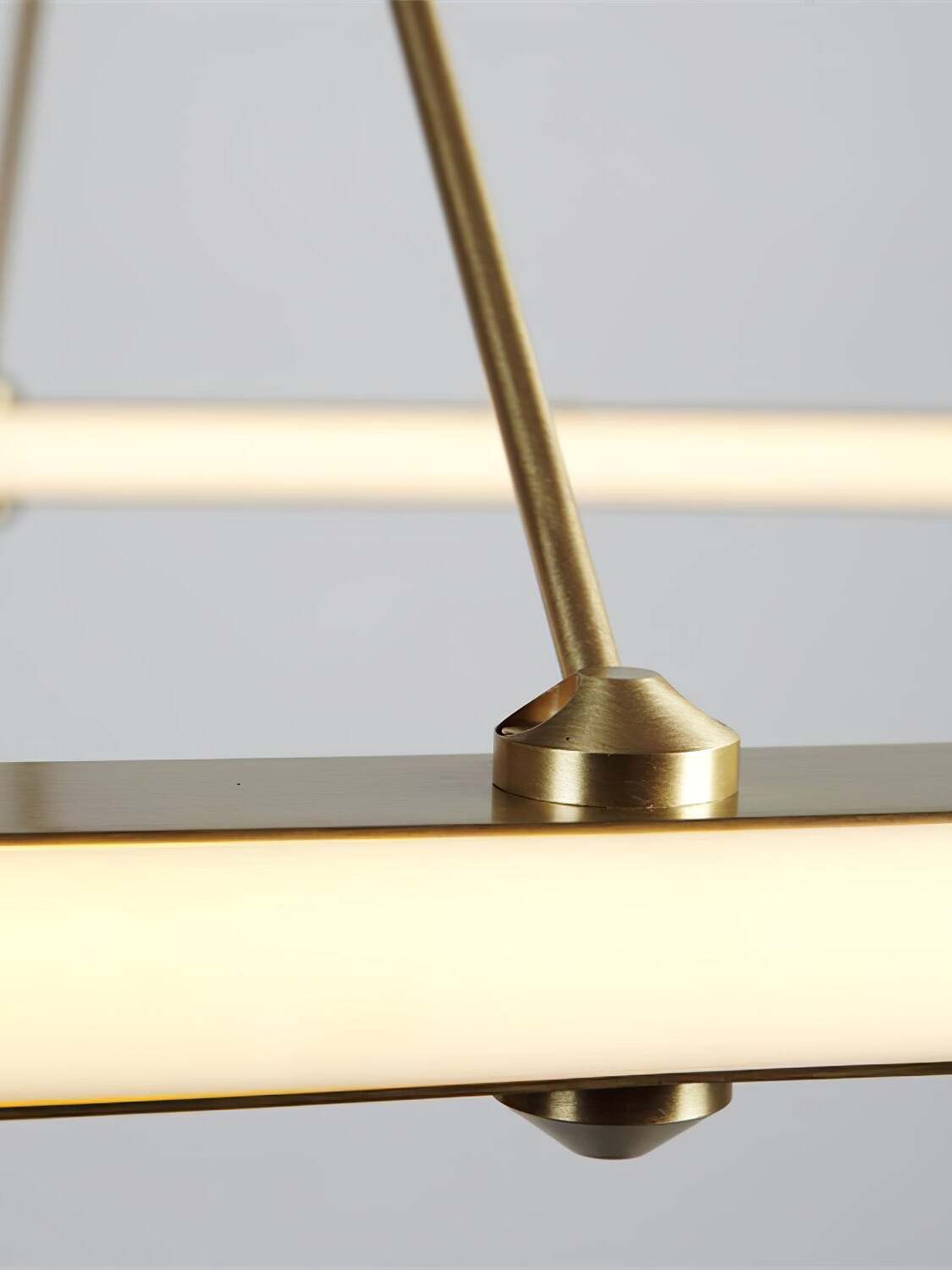 Gold support rod joining the illuminated circular rail