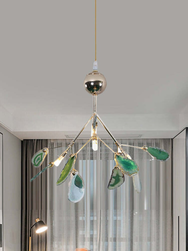 Small green stone-slice chandelier by curtains