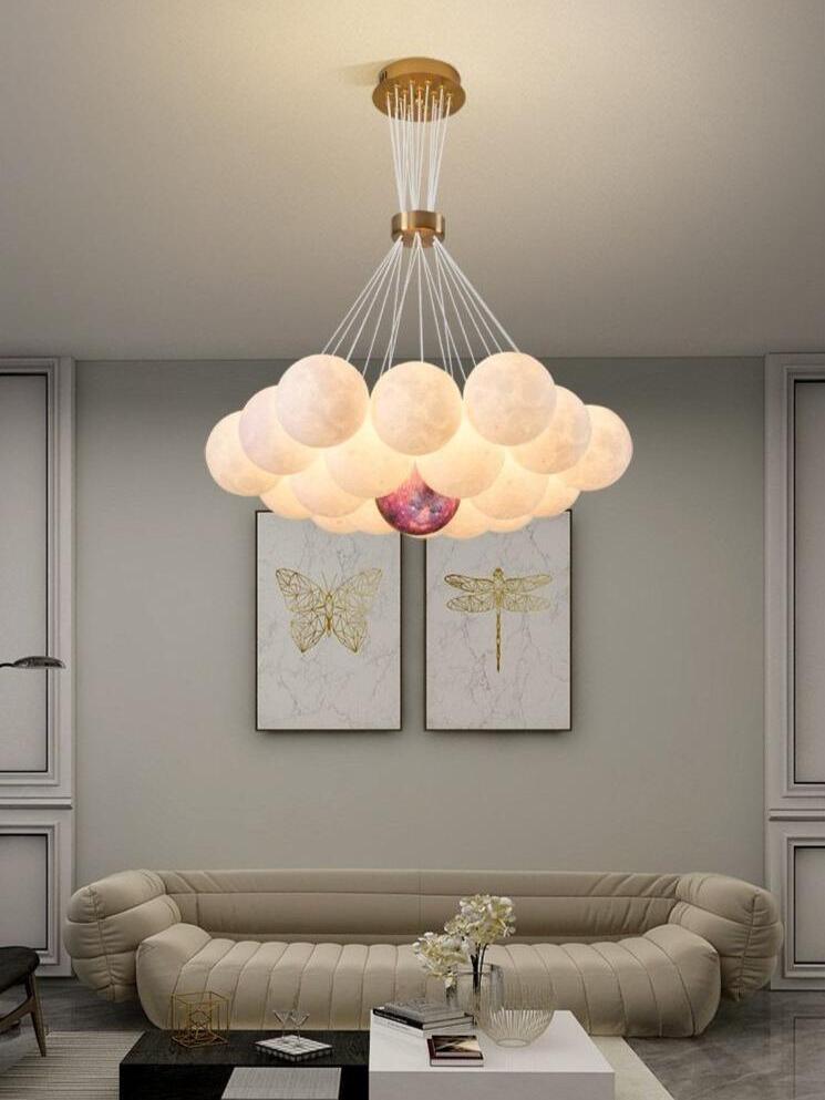 Lunar cluster pendant above a sofa and framed pictures