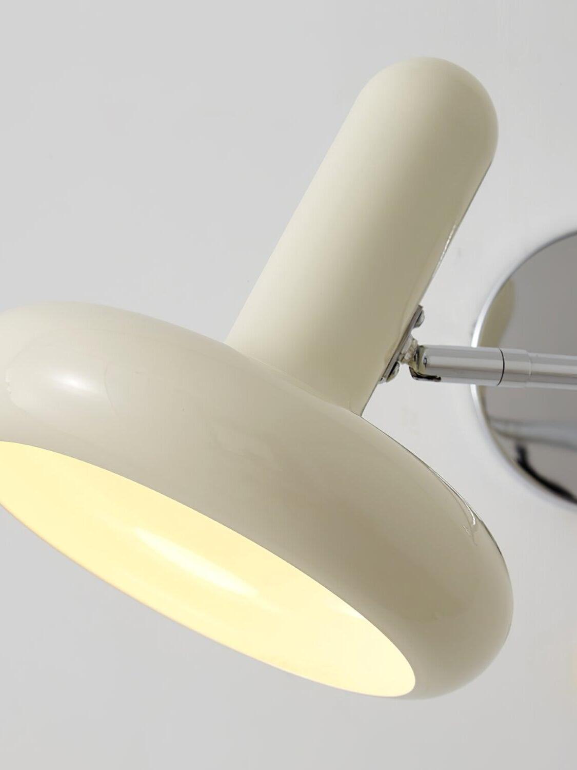 Close view of glowing cream disc shade and upright tube