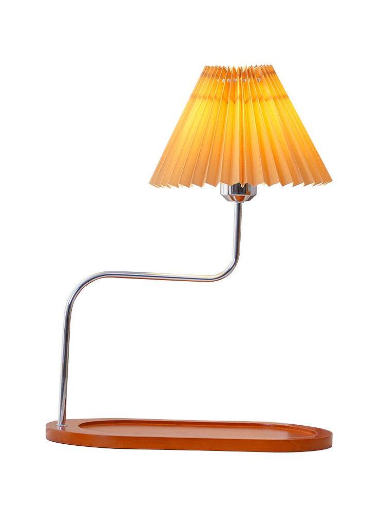 Orange-toned pleated shade on metal stem and long tray