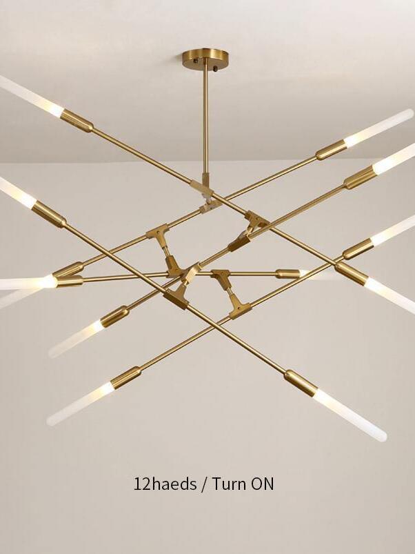 Gold chandelier pictured with twelve-head label and lights on
