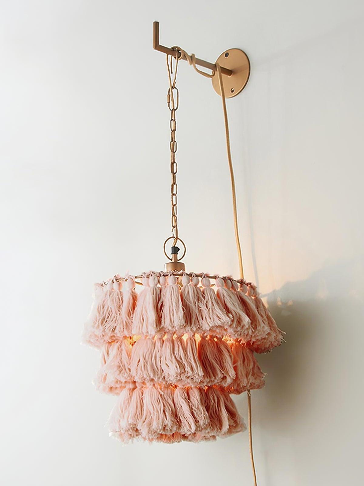 Pink tassel shade and gold-coloured bracket