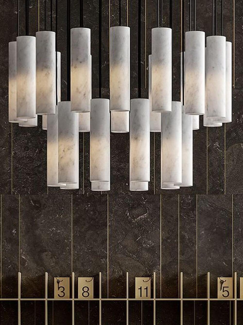 Close view of overlapping Silo cylinders and dark suspension cords above a numbered shelf