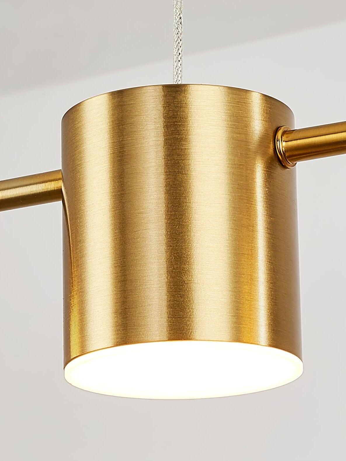 Close-up of a gold cylindrical light and its glowing lower face