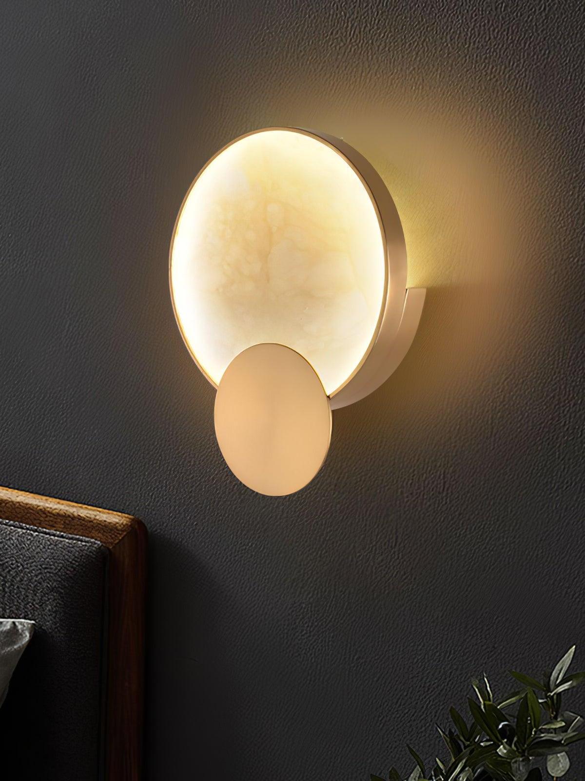 Angled view of glowing circular alabaster and lower disk