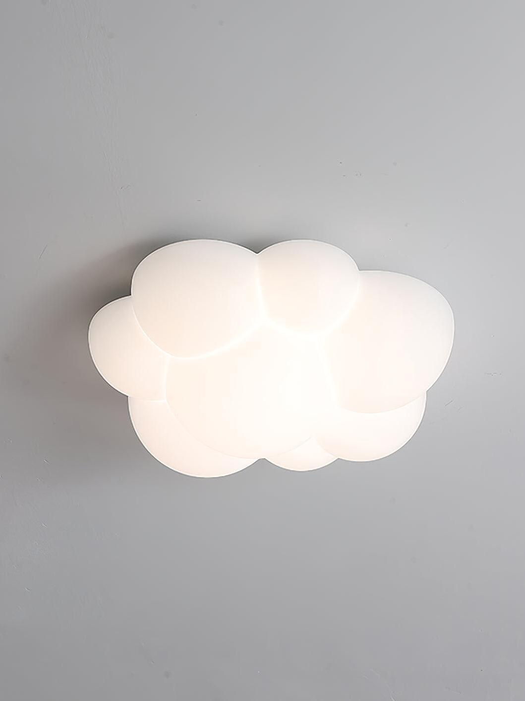 Nuage cloud light glowing pale white against a grey ceiling