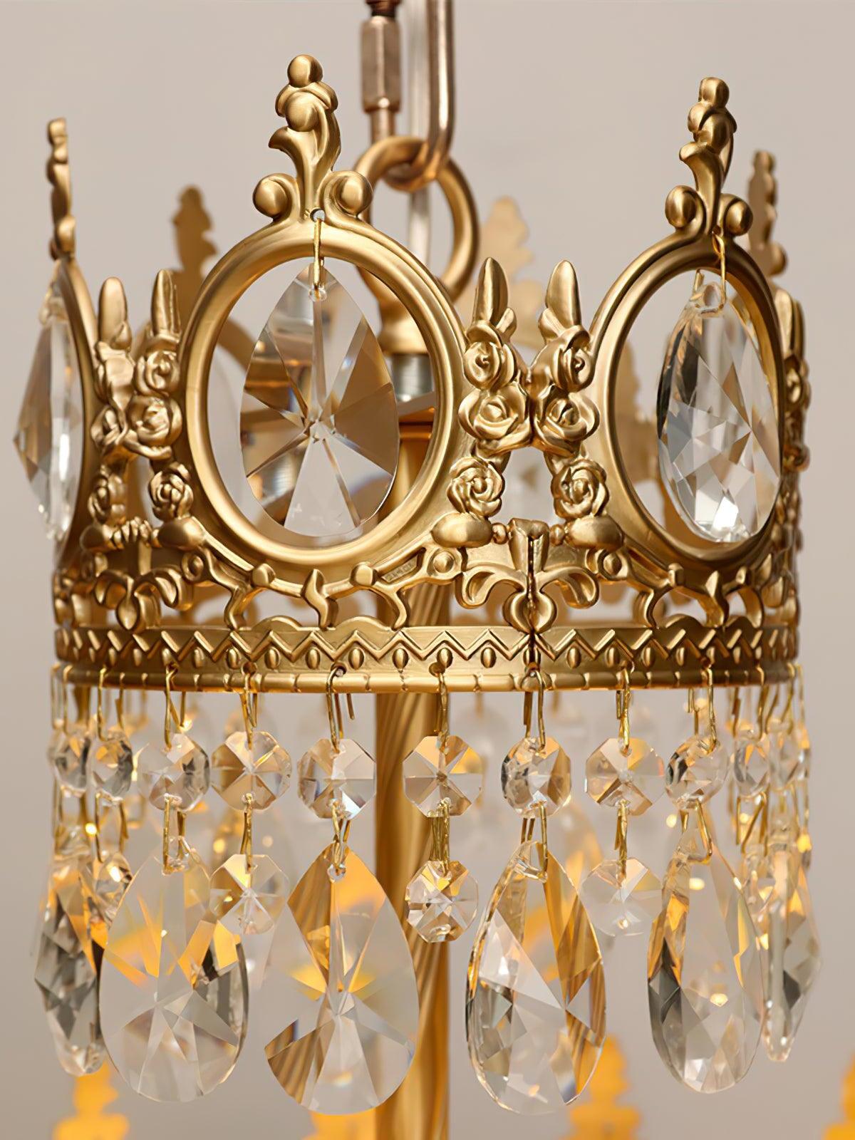 Gold-tone upper crown with oval faceted crystal inserts, ornamental tips and hanging teardrop pieces