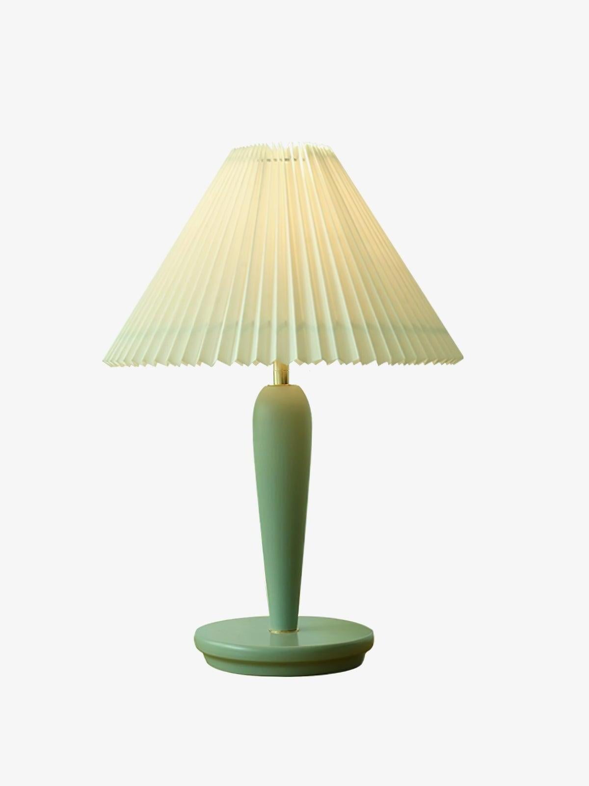 Light-blue table lamp with plain white pleated shade on white