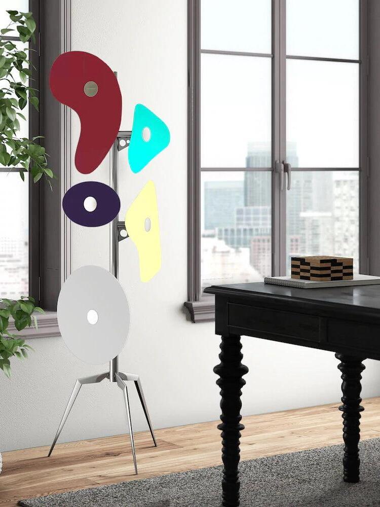 Multicolour floor lamp near a piano