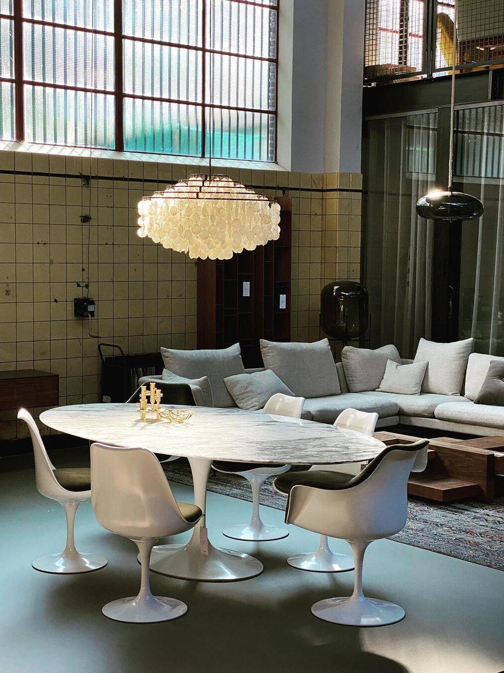 Shell chandelier in a dining and sitting area