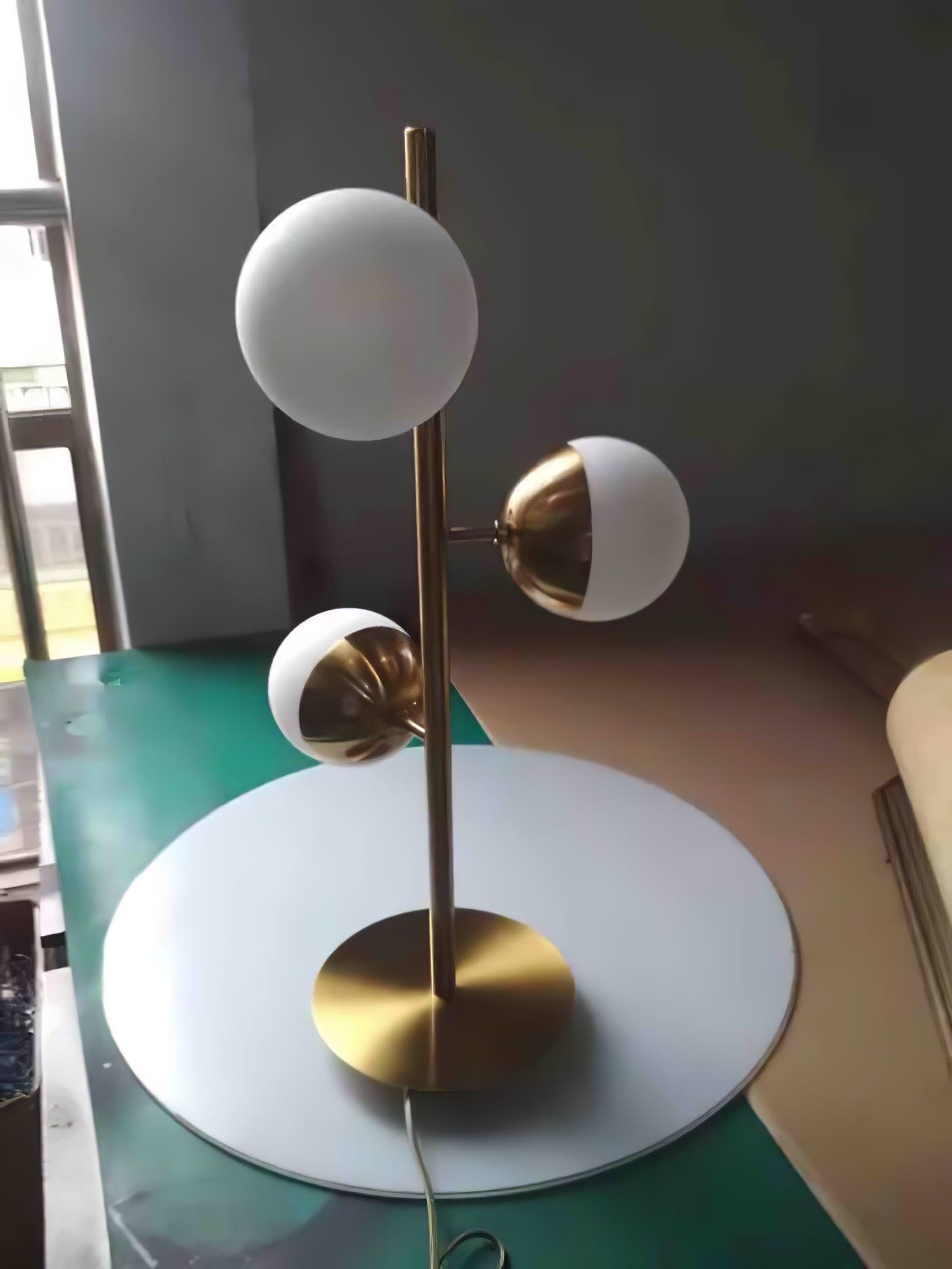 Short gold Doppler lamp on tabletop