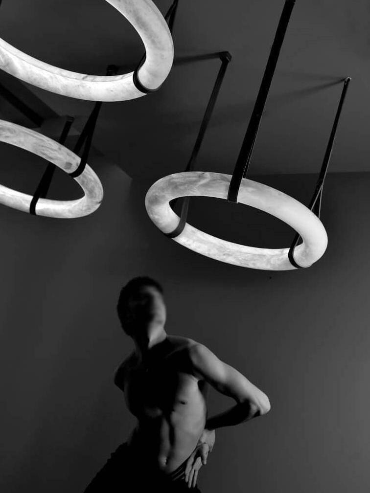 Horizontal alabaster rings against a dark background