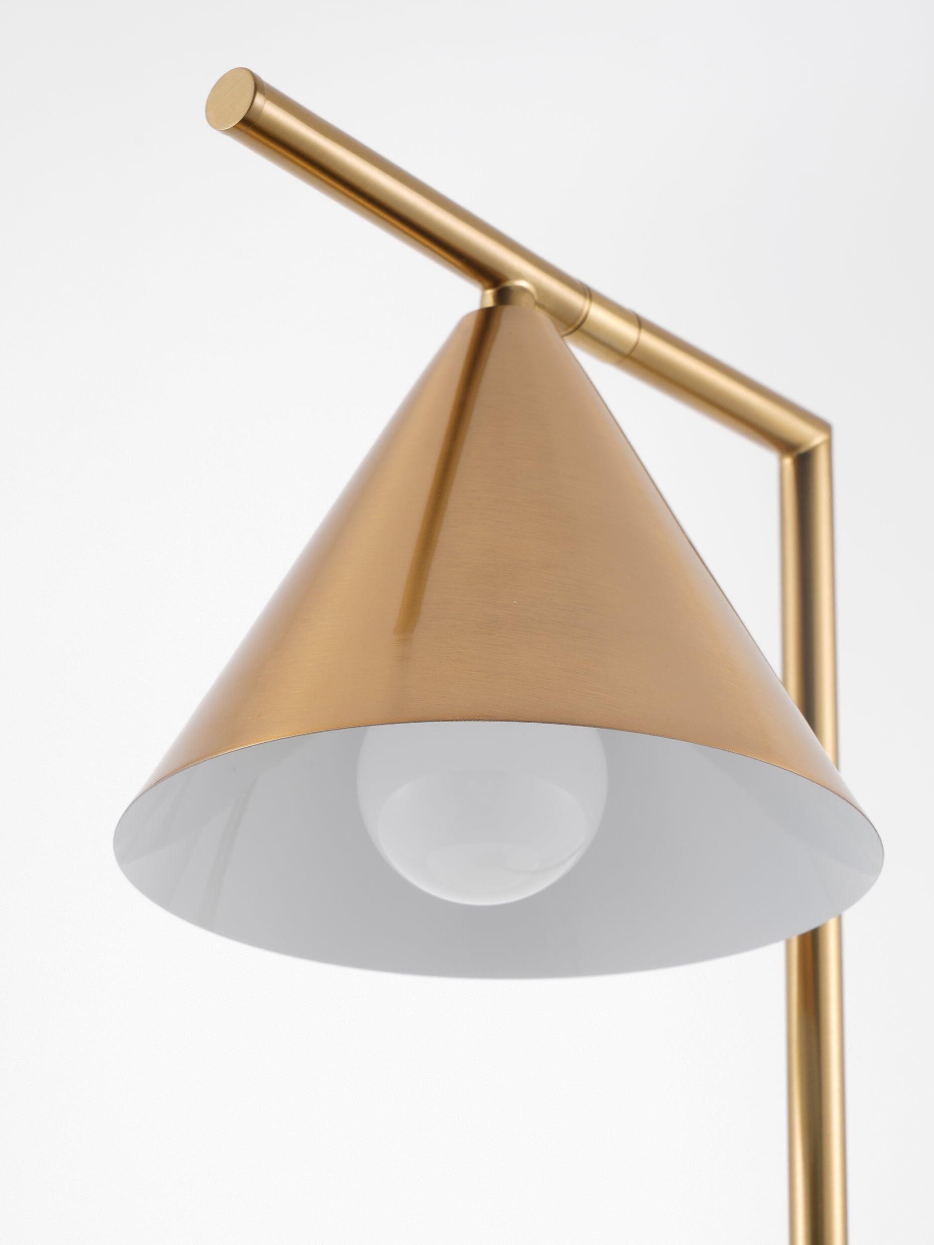 Open white underside of gold-tone cone shade with round bulb