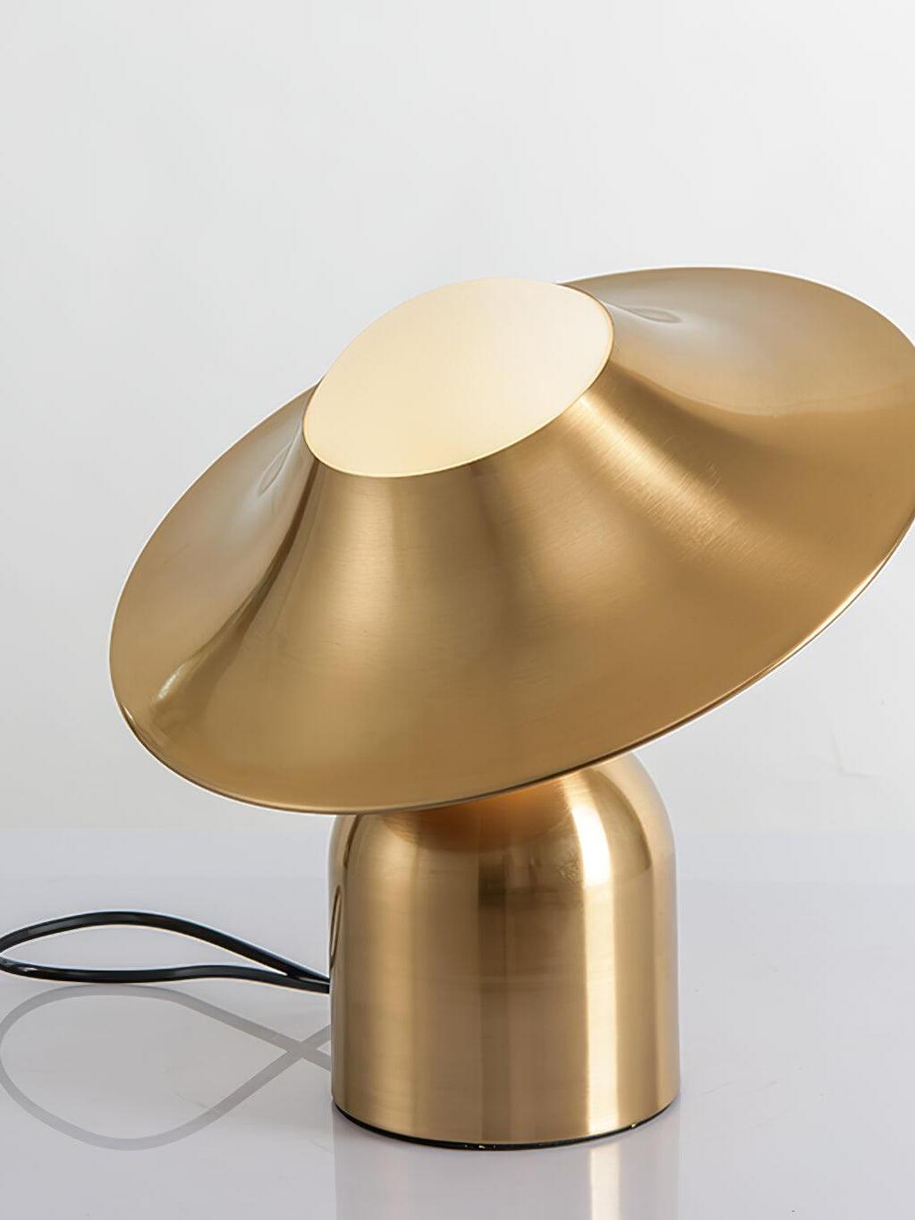 Unlit white globe under angled gold disc