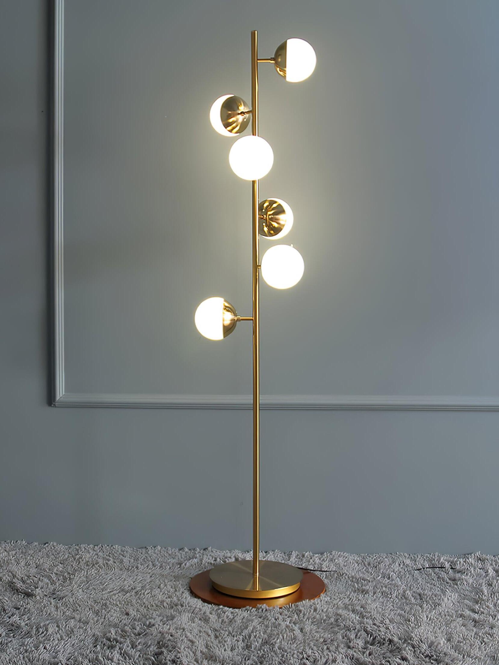 Tall gold lamp with alternating white globes