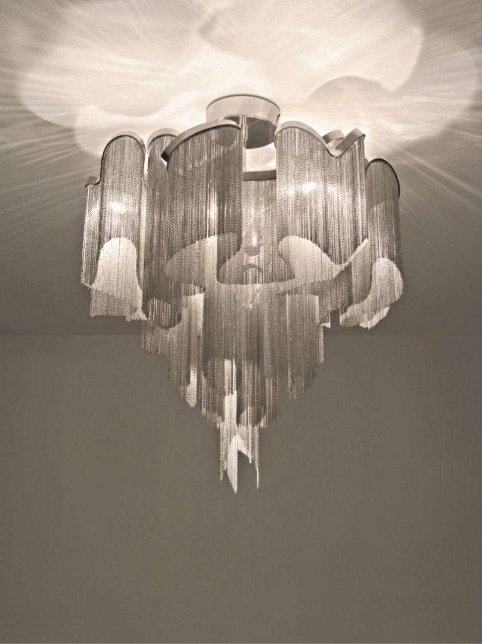 Layered silver-coloured chain chandelier below a ceiling