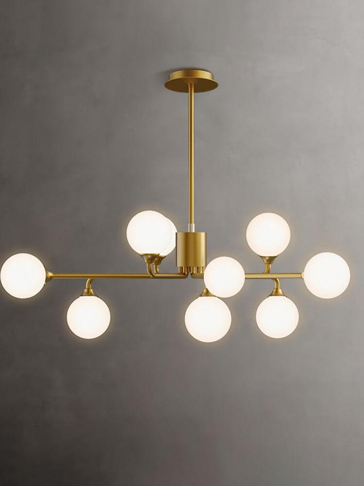 Nine-globe chandelier with staggered brass arms