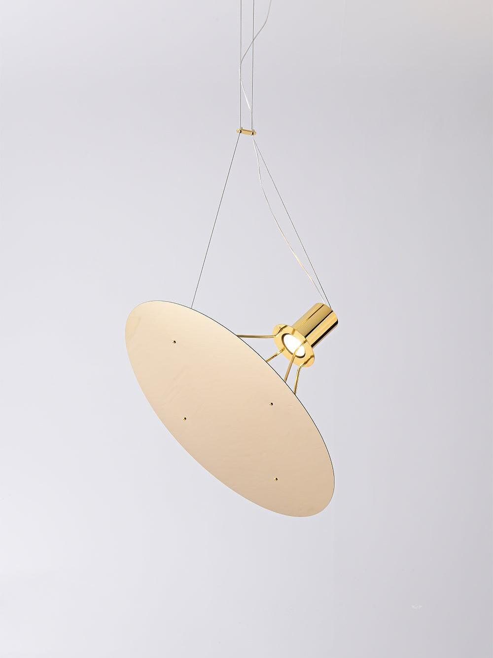 Circular pale disc beneath a Gold cylindrical module