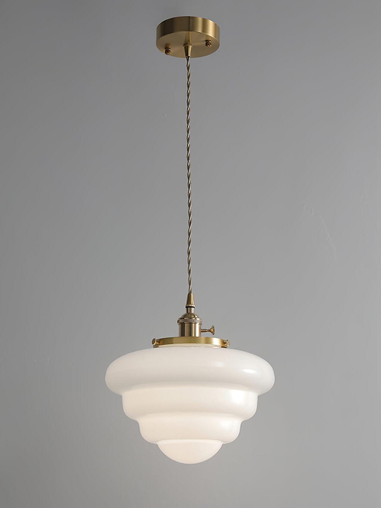 Atlas Model B single pendant with round brass canopy, twisted-looking cord, rounded white glass tiers and bowl-shaped bottom
