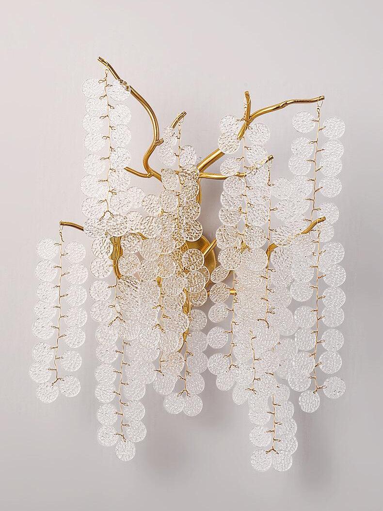 Unlit clear discs suspended from gold-toned branches