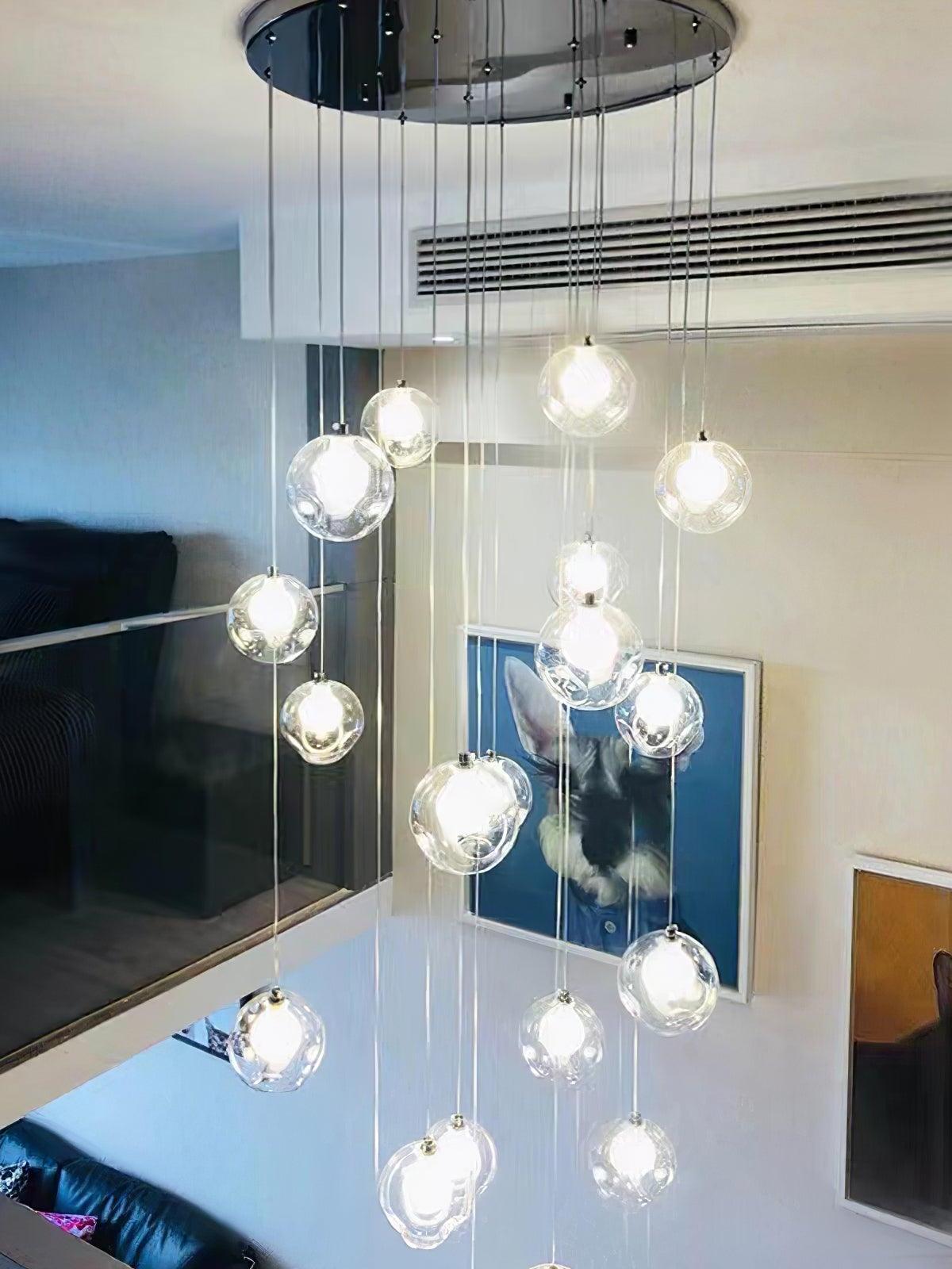 Hanging clear globes over a double-height room
