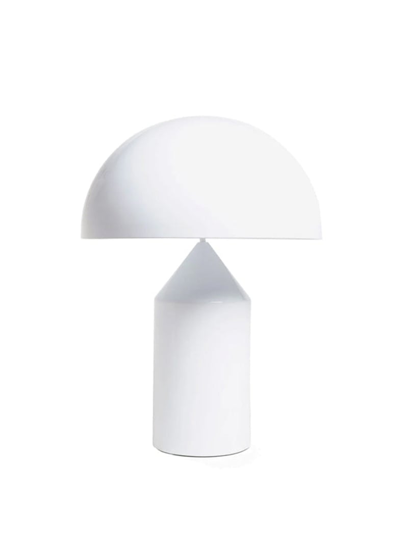 White dome table lamp above a cone-topped cylindrical base on a pale background