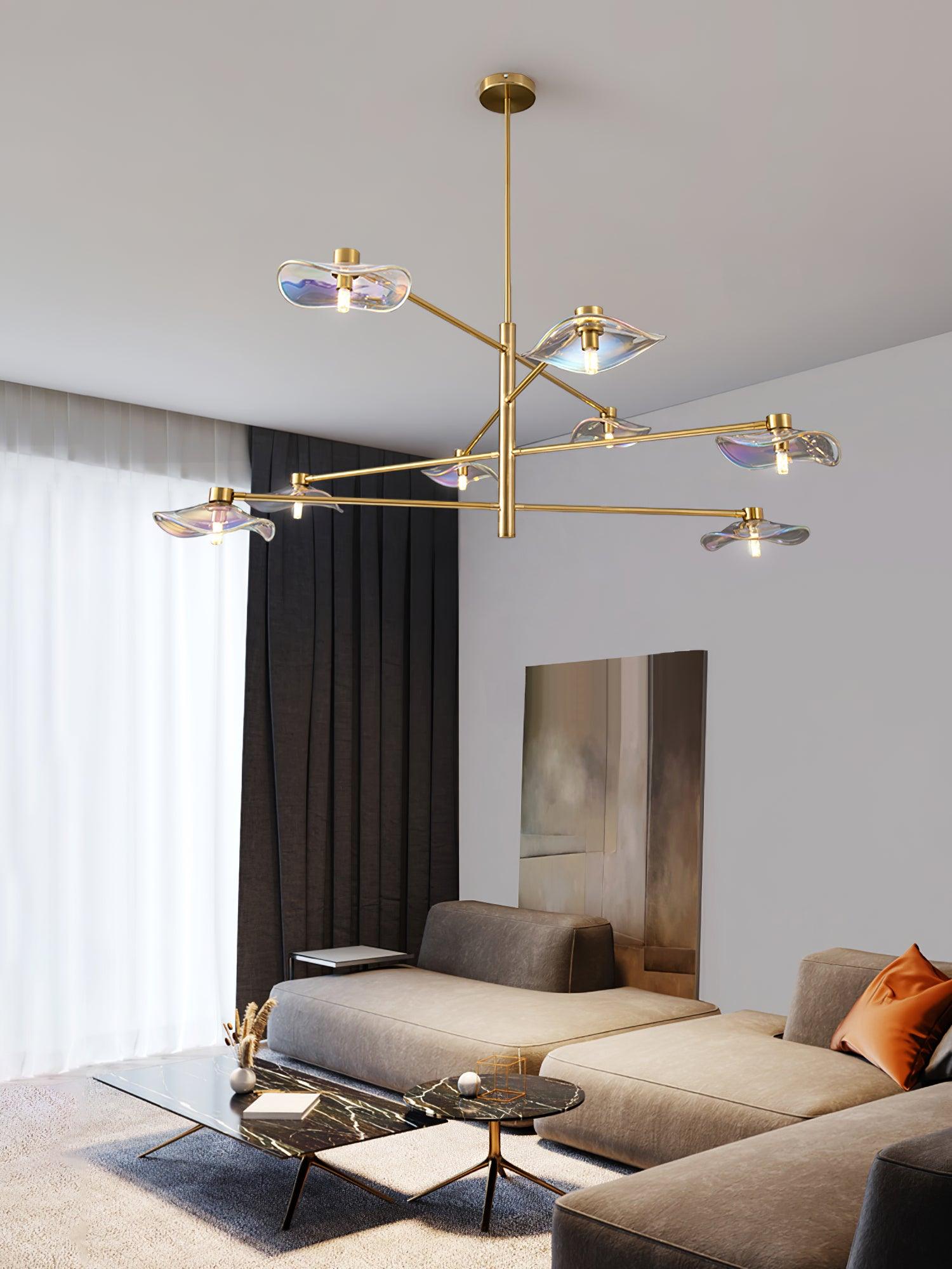 Gold Calla chandelier near tall curtains