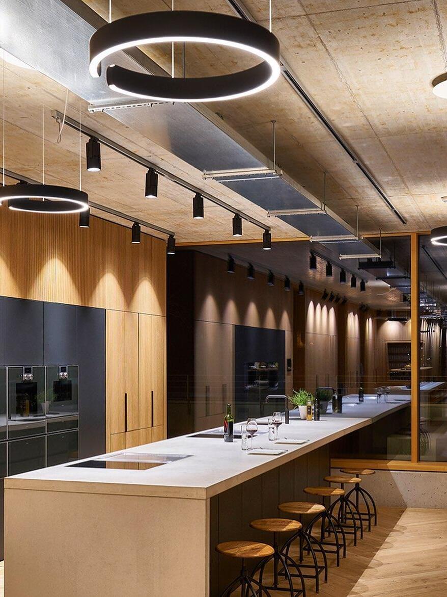 Ring lights above a long kitchen island