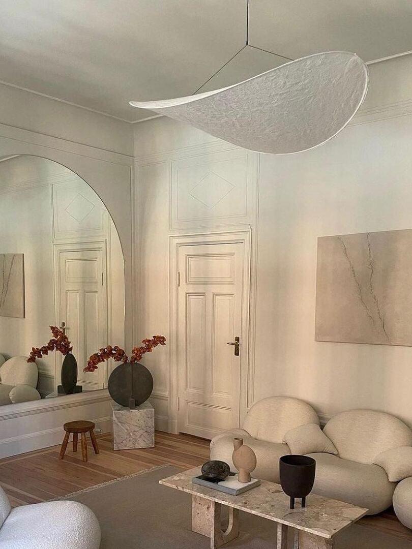 White curved shade above a living room