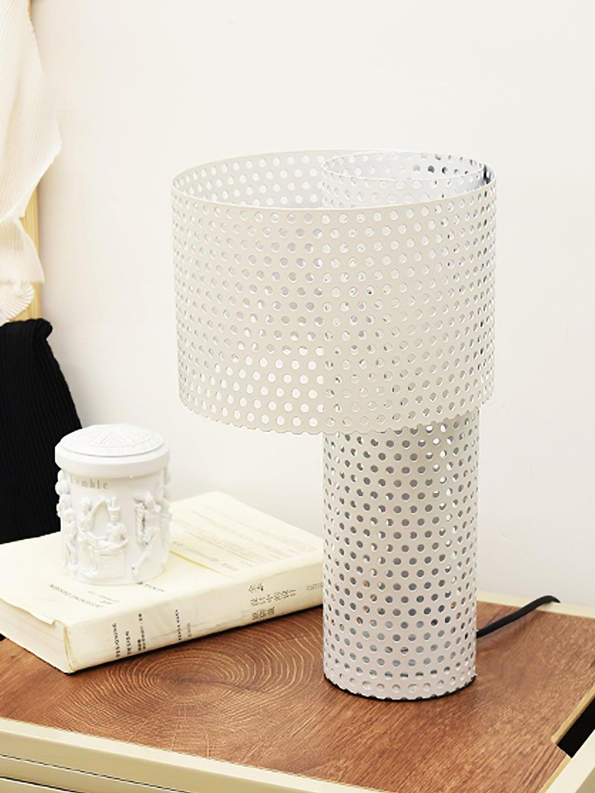 White Embrey table lamp beside books and cup on desk