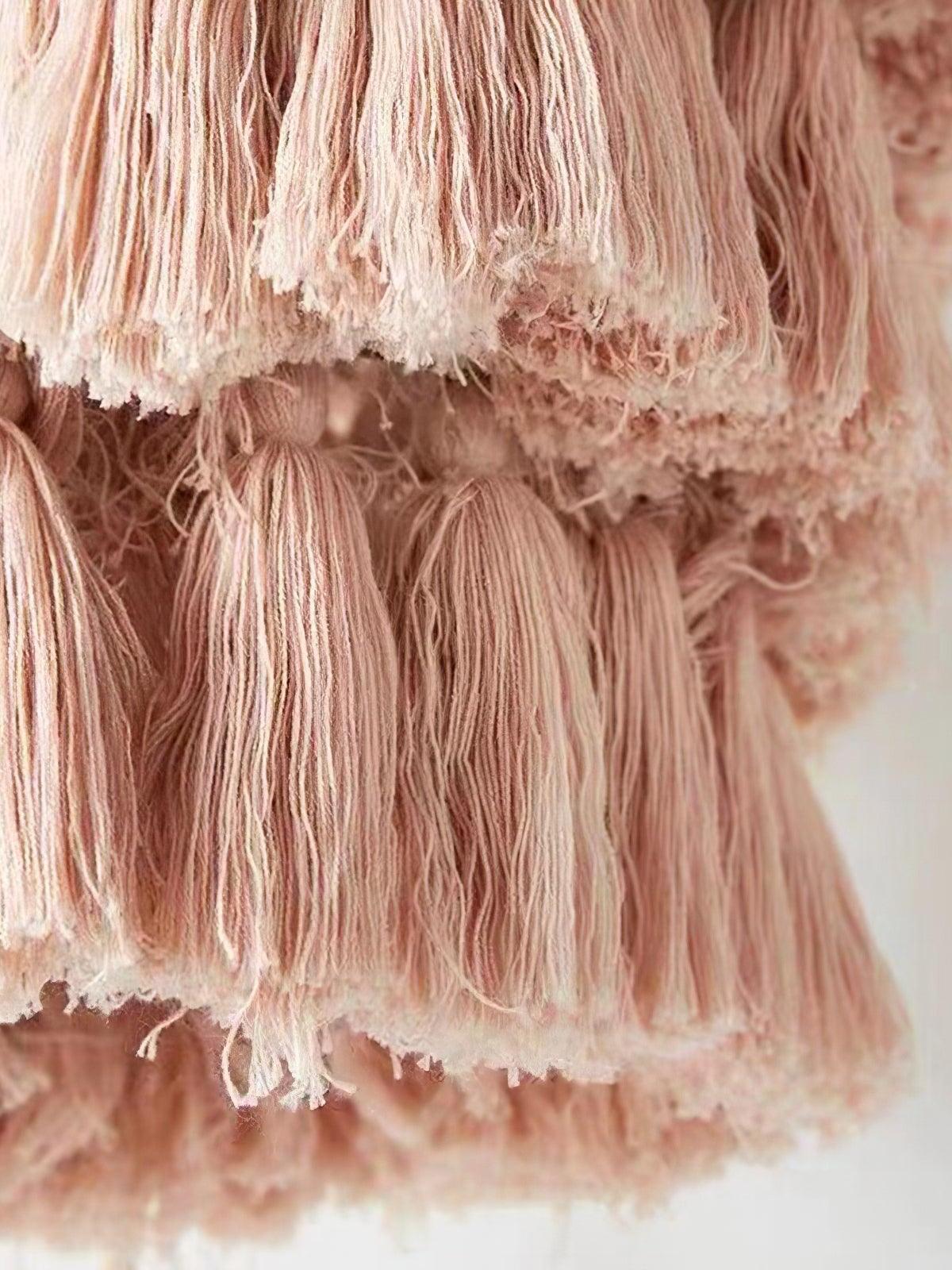 Close-up of pink fabric tassel bundles