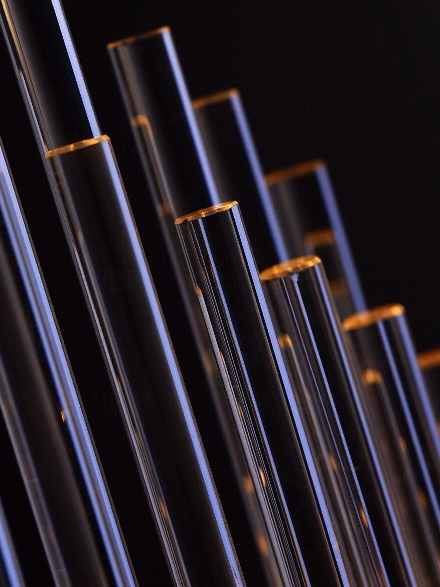 Close clear rod ends against dark background
