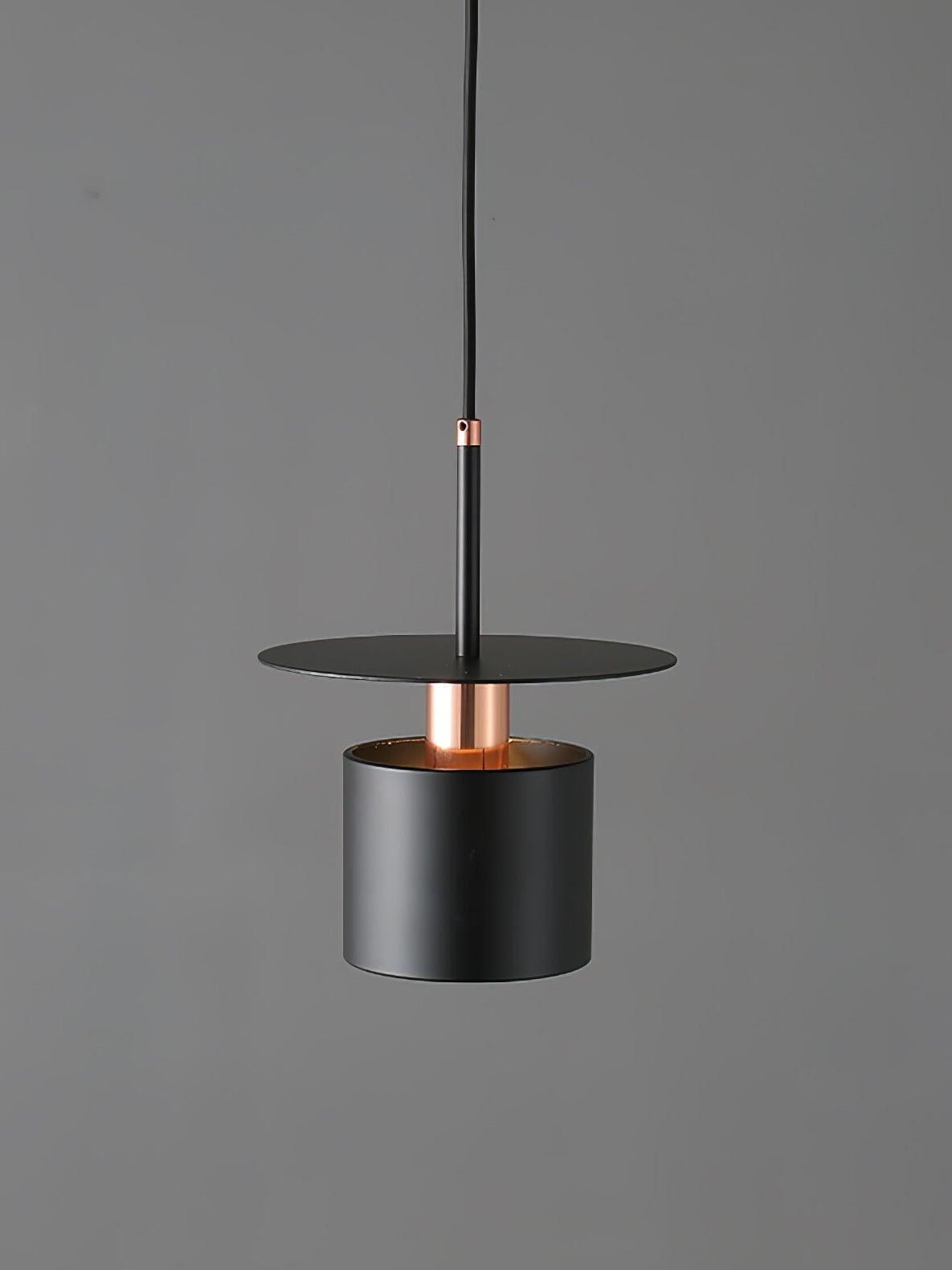 Black disc pendant on grey background