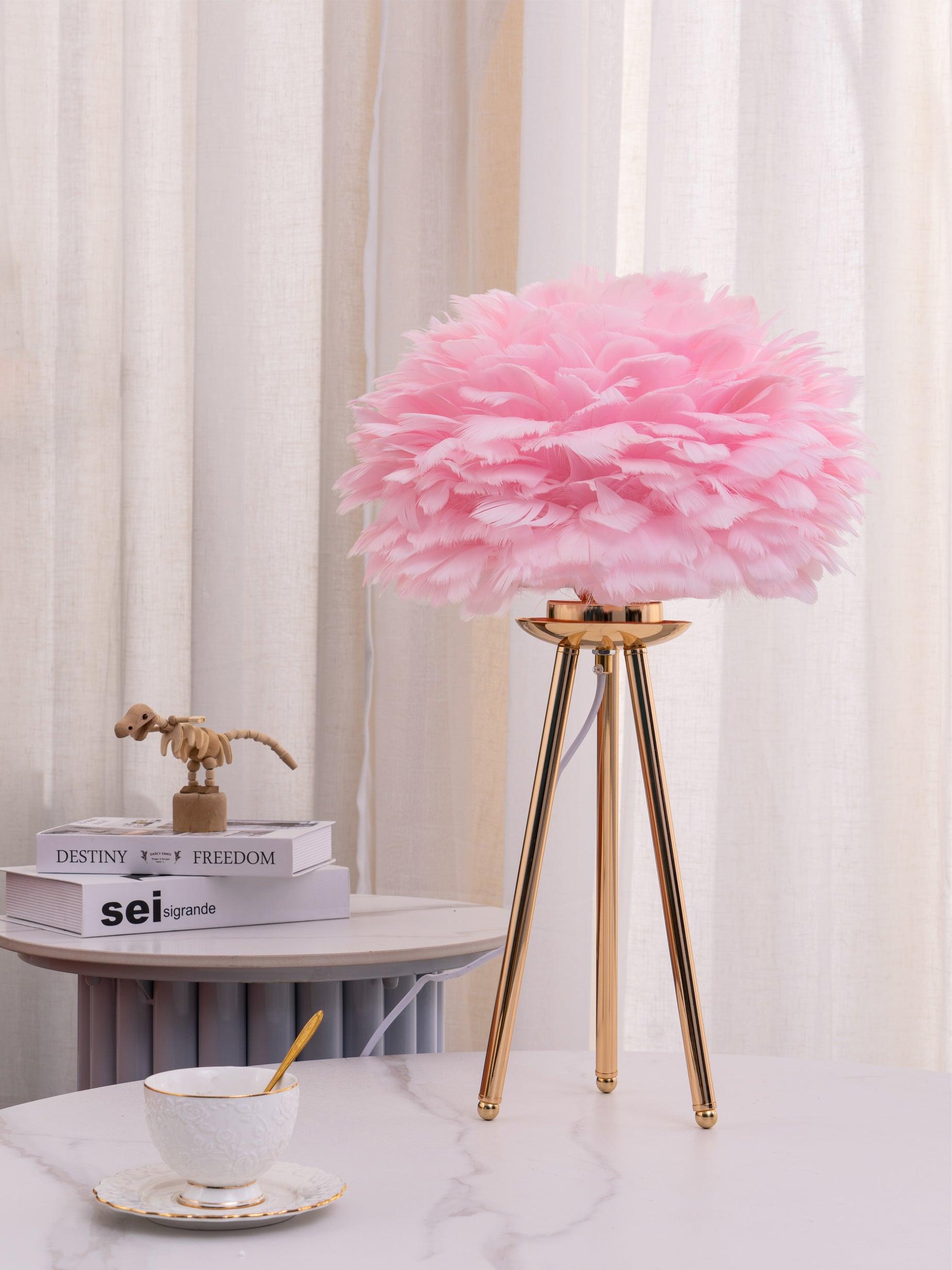 Deep pink feather lamp on white tabletop