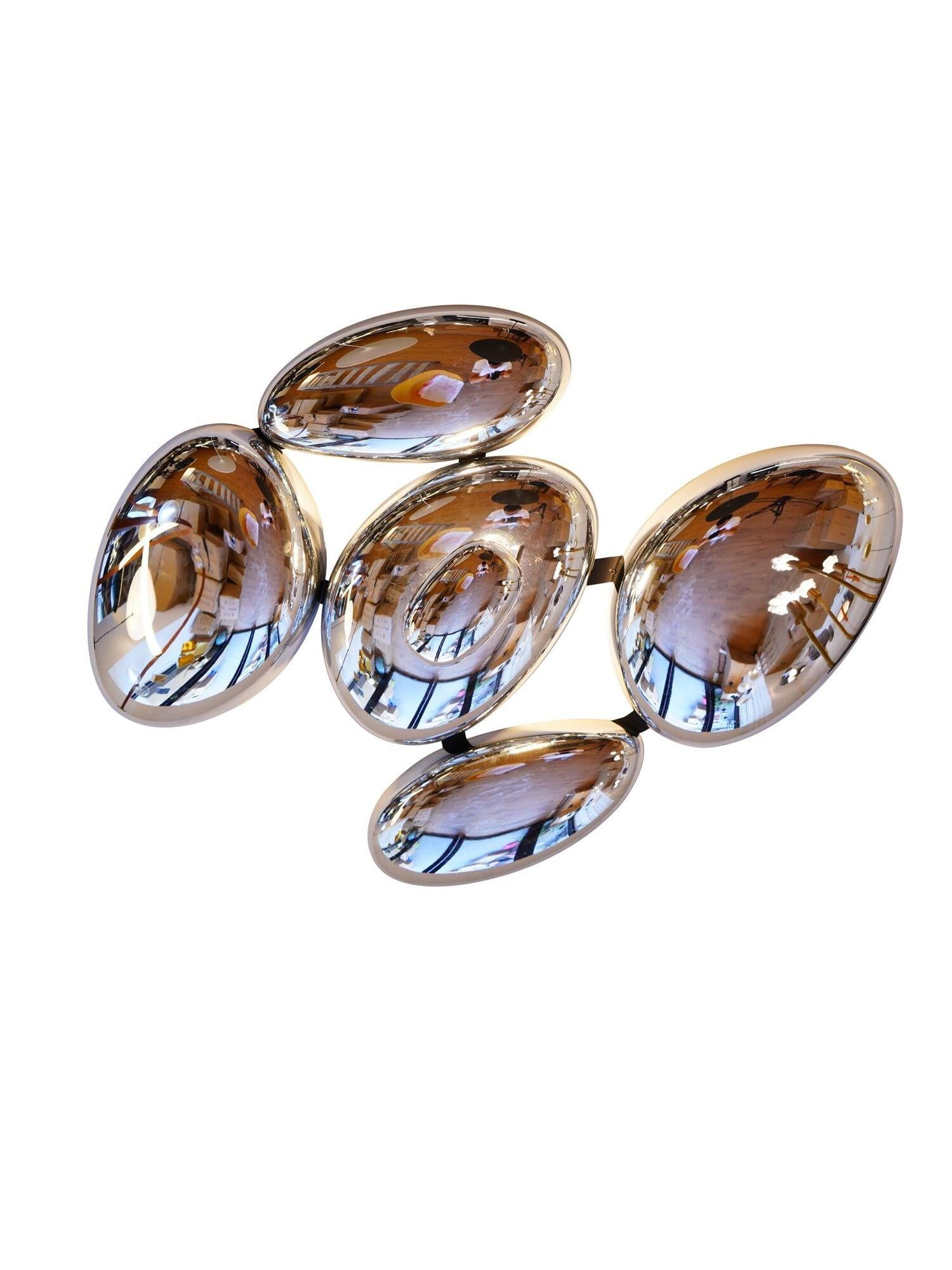 Isolated reflective pebble cluster with warm-toned reflections on white background