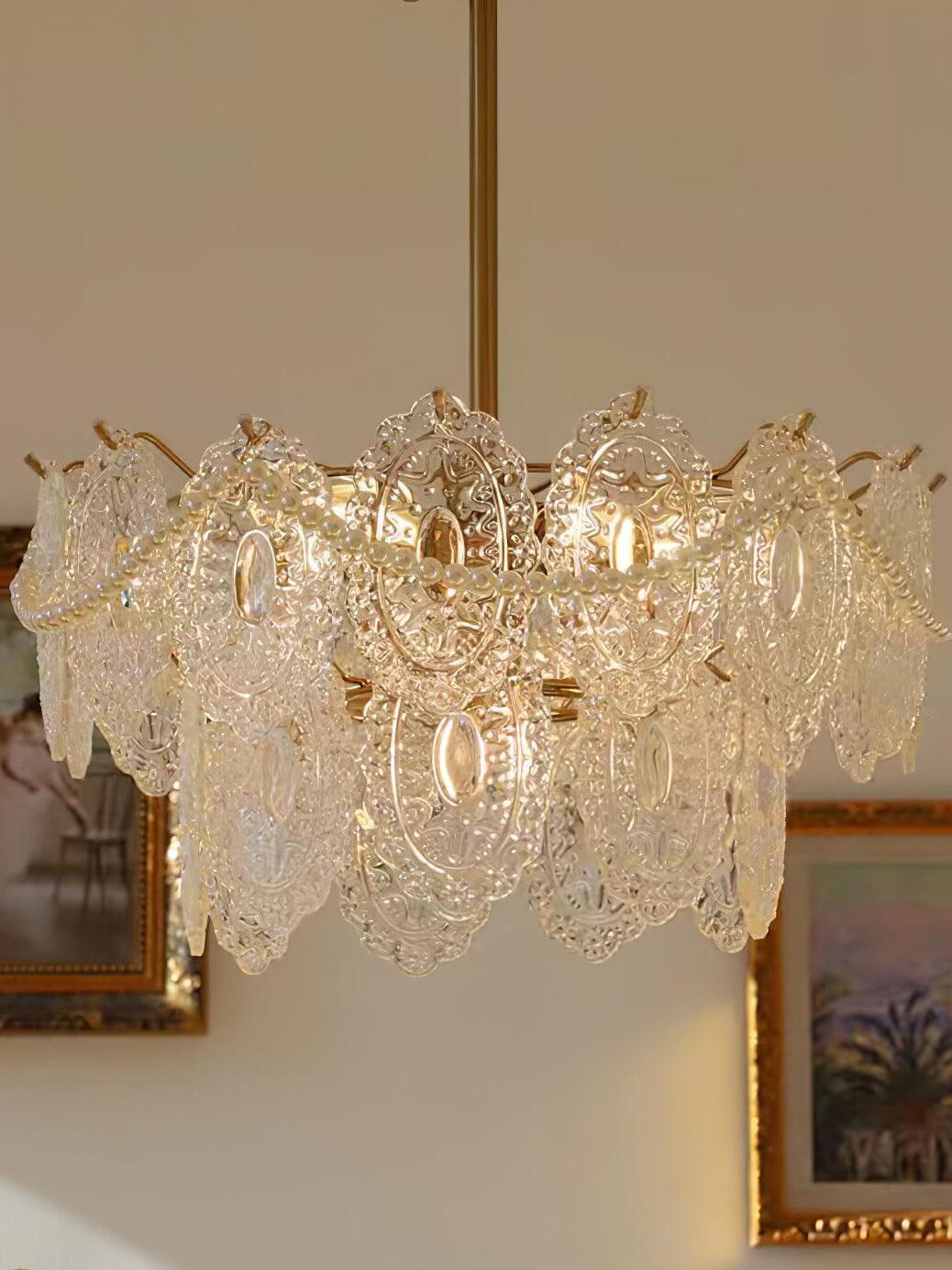 Clear glass chandelier near framed wall art