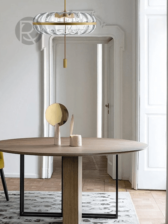 Jolie pendant above a round dining table