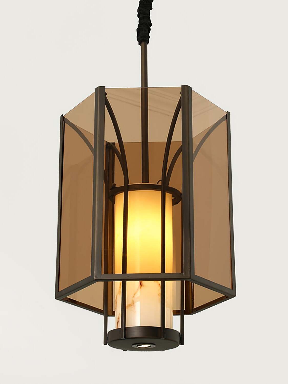 Close lit amber glass lantern with veined inner shade