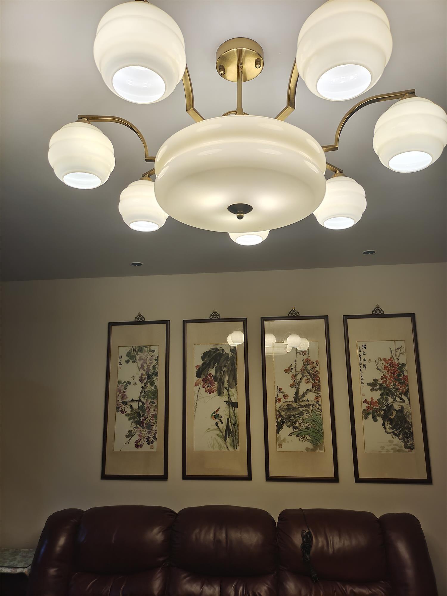 Chandelier above a living-room seating area