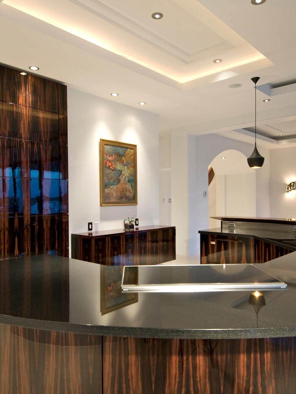 Wide black pendant above a dark counter