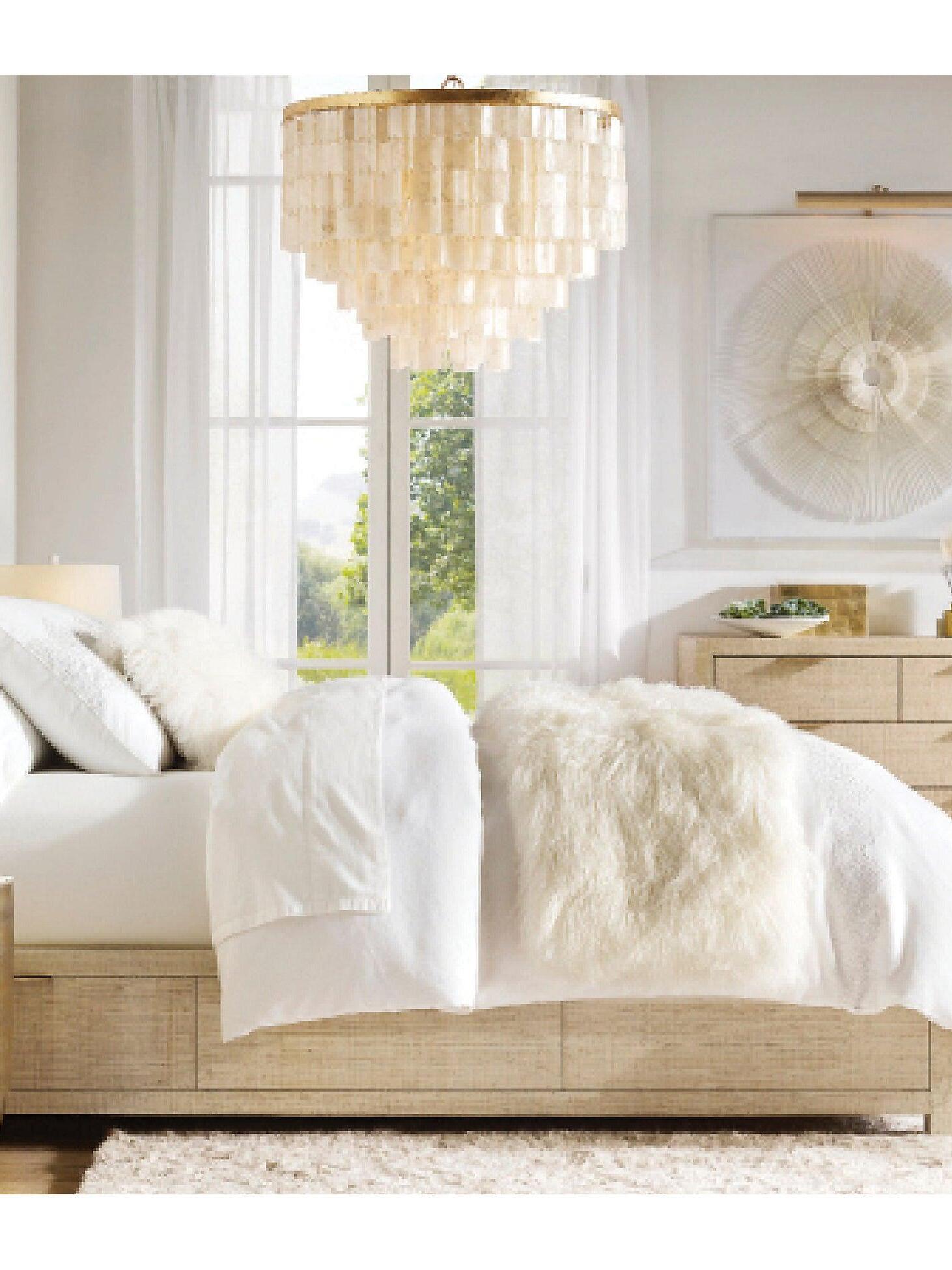 Shell pendant hanging in a neutral bedroom