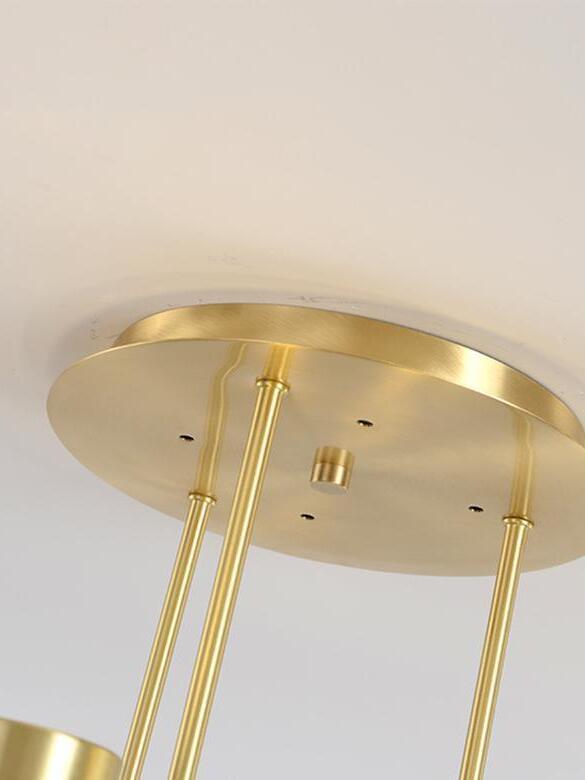 Gold-coloured canopy and suspension stem close-up