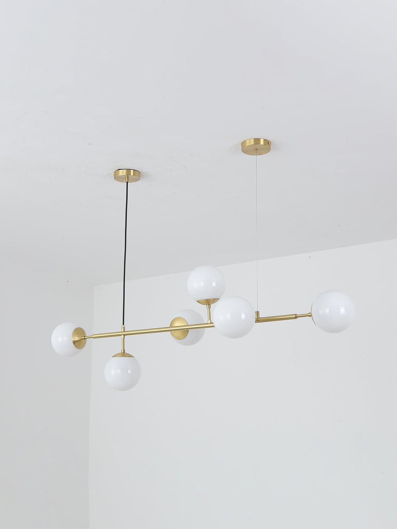White globe chandelier with two separate ceiling plates