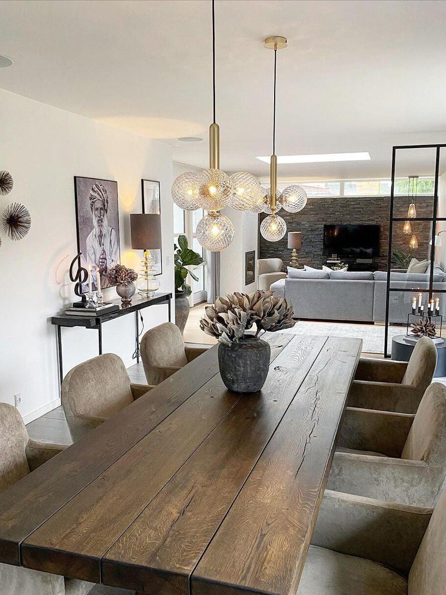 Gold-coloured glass cluster over a long dining table