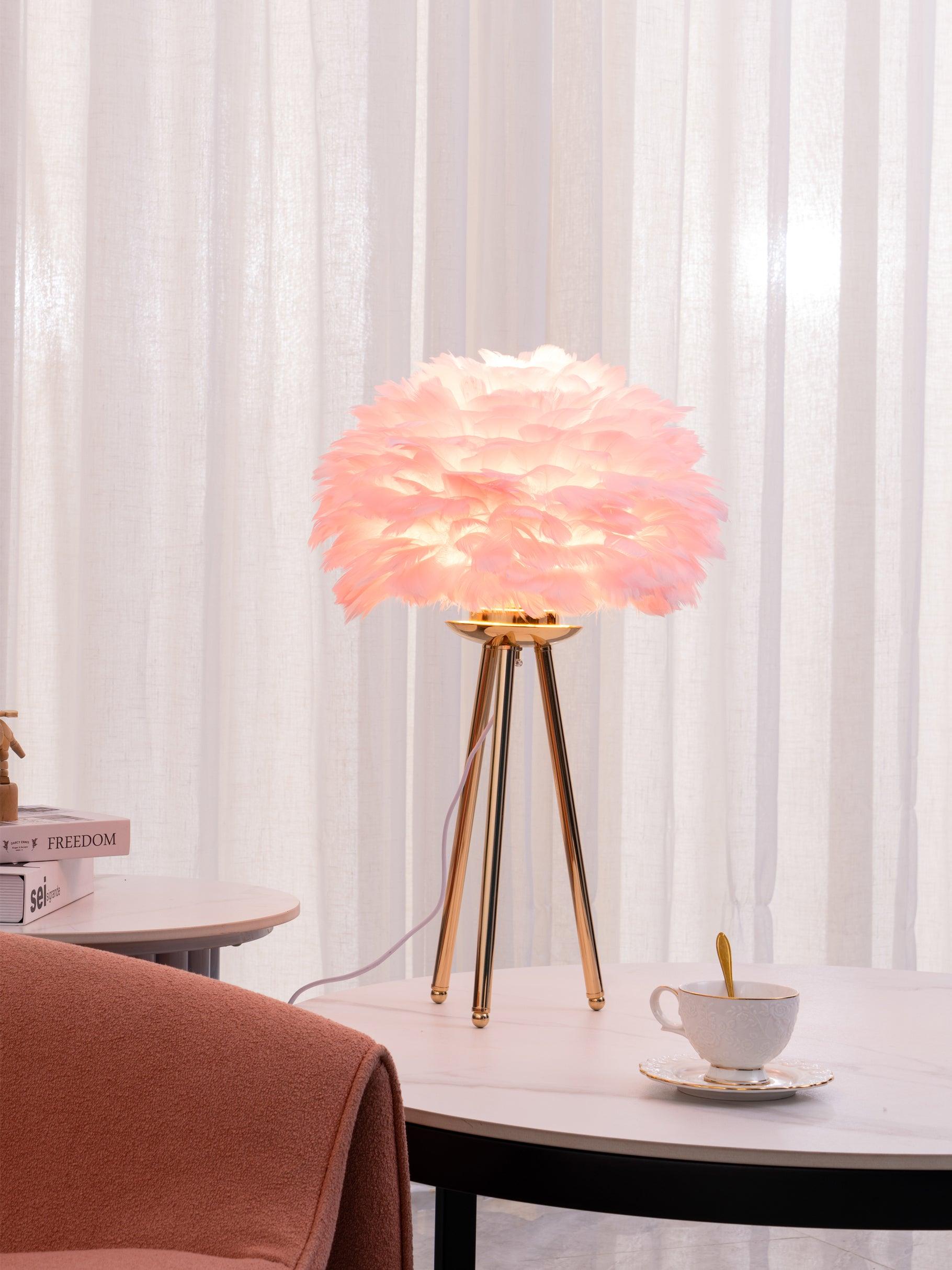 Pink feather-shade lamp before white curtains