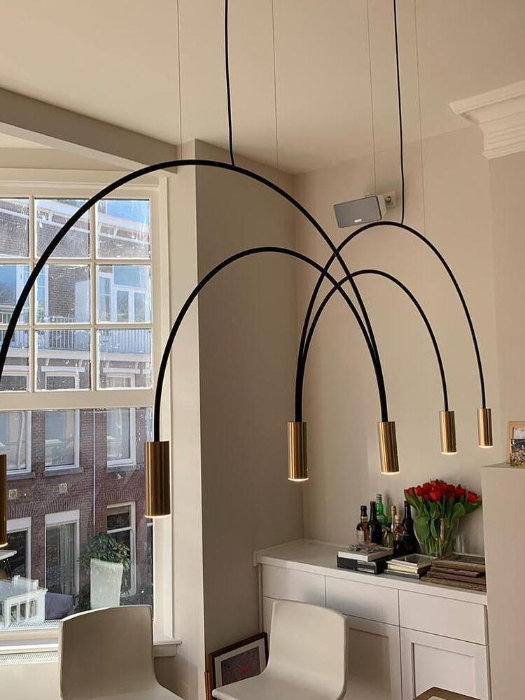 Close view of Black arcs ending in Gold cylindrical heads