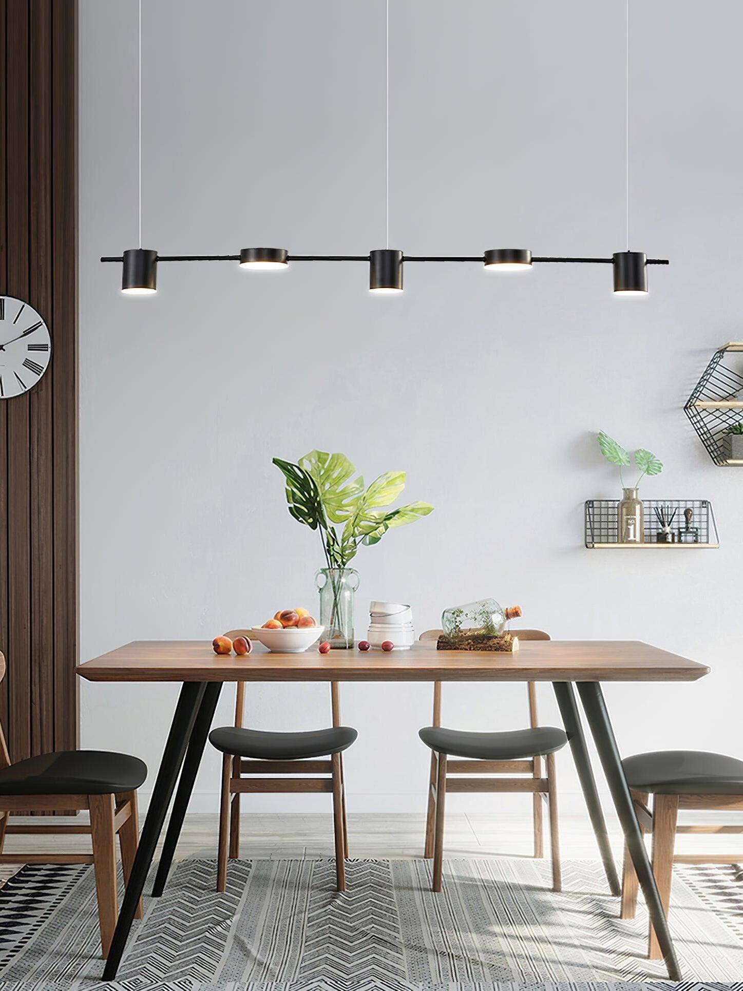 Black linear light above a wooden dining table