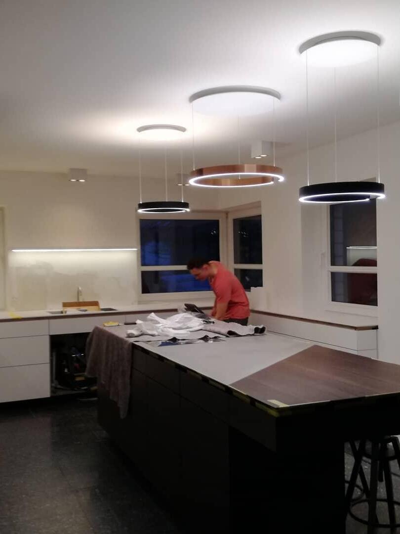 Ceiling-close and suspended rings pictured in a kitchen