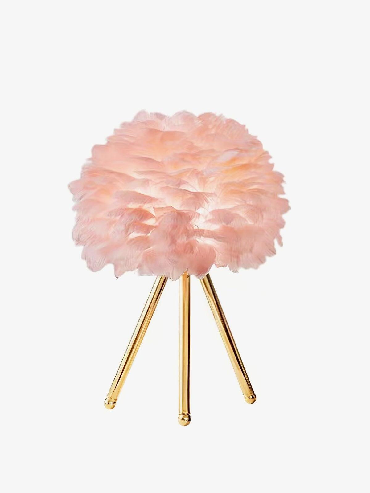 Pink feather shade on gold tripod against white
